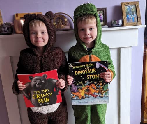 Rowan and Reuben Spencer as the Cranky Bear and a dinosaur from Saturday Night at the Dinosaur Stomp.