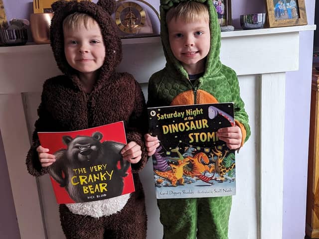 Rowan and Reuben Spencer as the Cranky Bear and a dinosaur from Saturday Night at the Dinosaur Stomp.