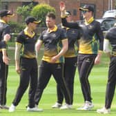 Alex King (no cap) celebrates a five wicket haul for Lincolnshire.
