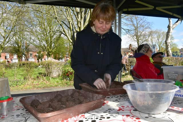 Karena Hall, of Boston, making wildflower seed bombs.