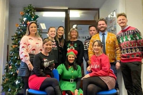 Staff at Newton and Fallowell on Roman Bank, Skegness, in the Christmas jumpers.