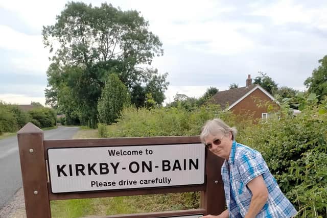 Jill Russell with the new Kirkby signs.