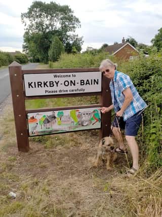 Jill Russell with the new Kirkby signs.