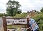 Jill Russell with the new Kirkby signs.