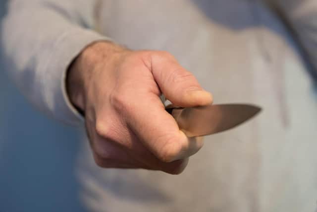 File photo dated 16/01/20 of a model poses holding a knife. Metropolitan Police Commander Alex Murray told the PA news agency that, while overall homicide figures in the English capital have dropped, the number of teen deaths has risen. Issue date: Tuesday July 27, 2021.