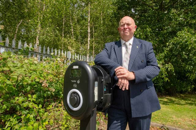 Coun Colin Davie with the Aura Business Centre EV charger in Skegness.