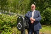 Coun Colin Davie with the Aura Business Centre EV charger in Skegness.