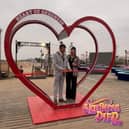Mayor and Mayoress of Skegness Couns Adrian Findley and Sarah Staples plave a love lock on Skegness Pier. Photo: Barry Robinson