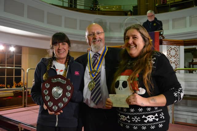 Rotary President John Moore presented the community award to Julie Lambie, left, and Sara Winter, founders of MRAG (Market Rasen Action Group)