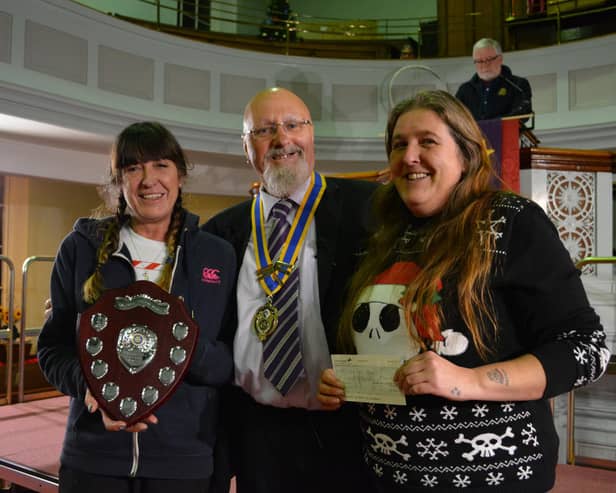 Rotary President John Moore presented the community award to Julie Lambie, left, and Sara Winter, founders of MRAG (Market Rasen Action Group)