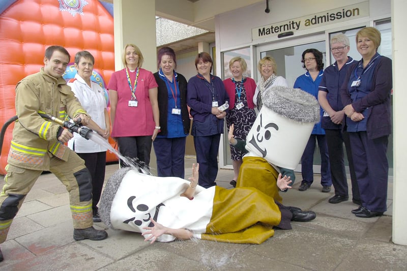 The fire service helping promote a smoking cessation message outside Boston's Pilgrim Hospital 10 years ago. Firefighter Simon Bedford is pictured putting out the 'cigarettes', watched by midwives and members of Phoenix Stop Smoking Service, (from left) Pauline Redfern, Angela Markham, Sue Pearson-Tipp, Libby Grooby, Hazel Harrison, Stephanie Heathcote, Michelle Hopkins, Lorraine Stimson-Read, and Martine Pringle.