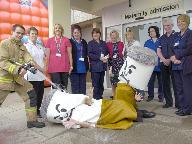 The fire service helping promote a smoking cessation message outside Boston's Pilgrim Hospital 10 years ago. Firefighter Simon Bedford is pictured putting out the 'cigarettes', watched by midwives and members of Phoenix Stop Smoking Service, (from left) Pauline Redfern, Angela Markham, Sue Pearson-Tipp, Libby Grooby, Hazel Harrison, Stephanie Heathcote, Michelle Hopkins, Lorraine Stimson-Read, and Martine Pringle.