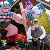 Jason Wilsher-Mills witrh his artwork in his garden at his Sleaford home.