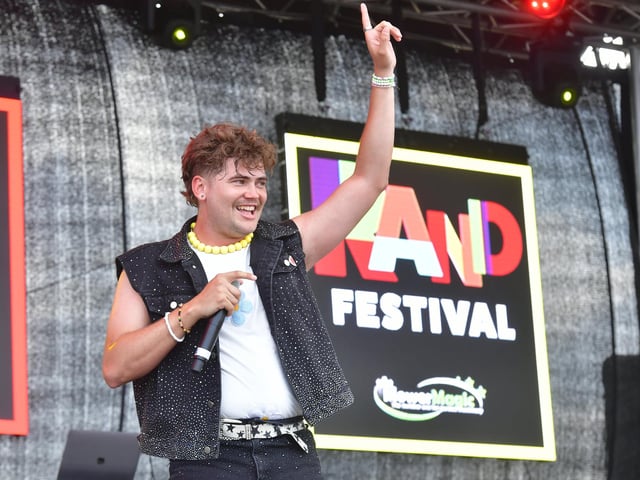 Harry Styled, the festival's Harry Styles tribute act, salutes the appreciative crowd.