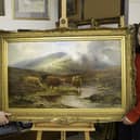 James Laverack and Tessa Laverack with Louis Hurt's painting of cattle by a stream in the Highlands. Image: Taylor's