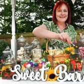 Lee Hubbard mans the Sweet Bar at Tanglewood Care Home's summer fair. Photos: Mick Fox