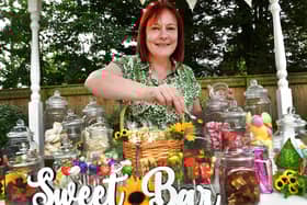 Lee Hubbard mans the Sweet Bar at Tanglewood Care Home's summer fair. Photos: Mick Fox