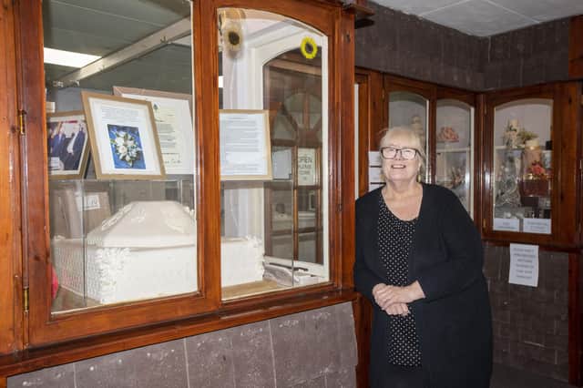 Sophisticake's Dawn Blundell with a life-sized replica of Prince Charles's wedding cake. Photo: Holly Parkinson Photography