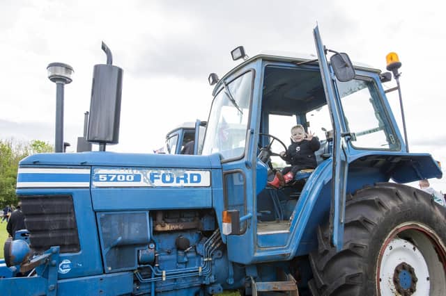 Theo Faupel, aged two, from Market Rasen, tries a tractor for size. Photo: Holly Parkinson