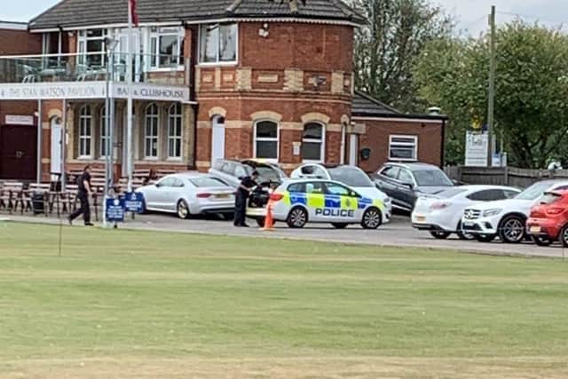 Police setting up a drone in the cricket clob car park.
