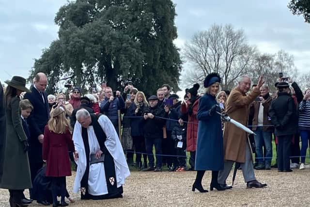 King Charles and Camilla the Queen Consort (right) greet the crowds while Reverend Canon Dr Paul Rhys Williams meets the Prince and Princess of Wales and their children Prince George, Princess Charlotte and Prince Louis.