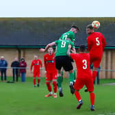 Sam Wright (no.17) gets up to head home one of Sleaford's goals on Saturday. Photo: Steve W Davies Photography.