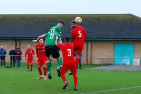 Sam Wright (no.17) gets up to head home one of Sleaford's goals on Saturday. Photo: Steve W Davies Photography.