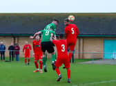 Sam Wright (no.17) gets up to head home one of Sleaford's goals on Saturday. Photo: Steve W Davies Photography.