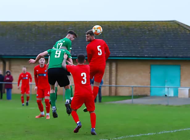 Sam Wright (no.17) gets up to head home one of Sleaford's goals on Saturday. Photo: Steve W Davies Photography.