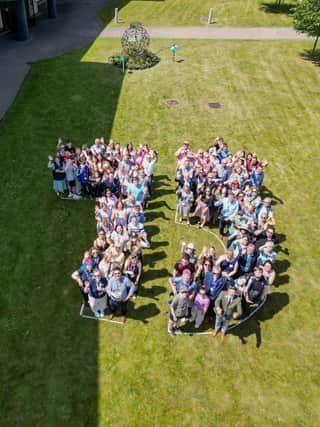 Students, staff and guests at Risefest lined up in the shape of the number 75 to represent Riseholme College's 75th anniversary.