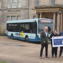 Pictured from left: Coun Tim Mitchell, cabinet member for connectivity; Holly Mumby-Croft, Scunthorpe MP; Karl Robinson, Hornsby Travel general manager; and Coun Carl Sherwood, cabinet member for safer, stronger communities – rural, in front of Normanby Hall. Image: North Lincs Council