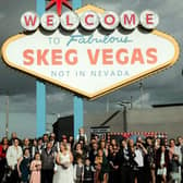 Kelly and Peter Tomlinson with their wedding party at the Skeg Vegas sign at Skegness Stadium.