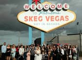Kelly and Peter Tomlinson with their wedding party at the Skeg Vegas sign at Skegness Stadium.