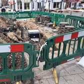 Emergency repairs under way in West Street, Boston.