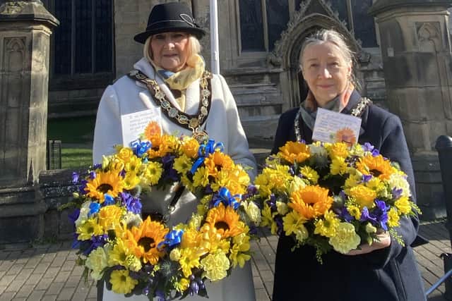 District councillors Lucille Hgues and Linda Edwards-Shea last year in Sleaford with bouquets of sunflowers - a symbol of Ukraine.