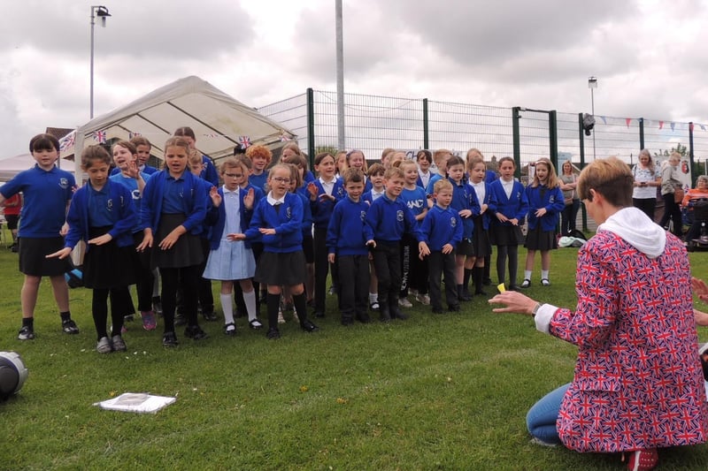 Winchelsea School choir perform at Ruskington's coronation fun day.