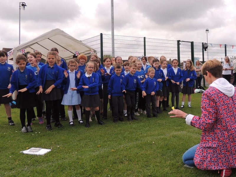 Winchelsea School choir perform at Ruskington's coronation fun day.