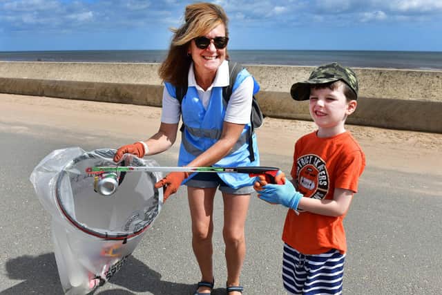 Jo Bowen with Jackson, 5, at the beach clean up.