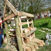 Ethan Scott, aged 12, and Adam Flemming making a Bug Hotel