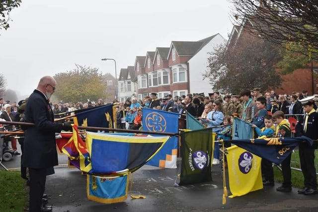 The standards are lowered during the Remembrance Day service.