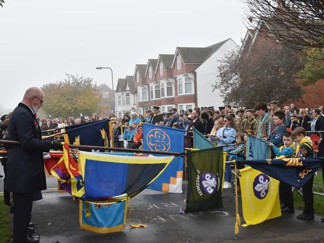 The standards are lowered during the Remembrance Day service.