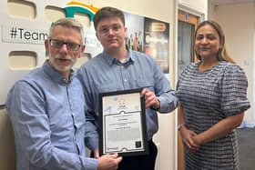 Lewis Mayo receives his Stagecoach Star of the Month Award from Darren Roe (left) and Hema Russell (right)