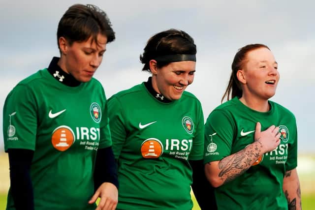 Steph Bradshaw celebrates with happy team mates.