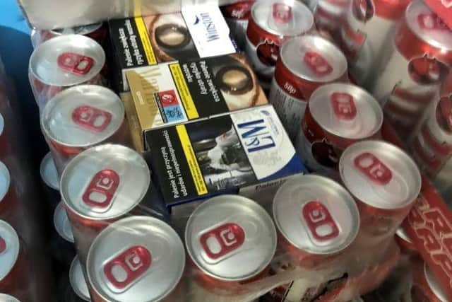 Cigarettes head in the middle of cans.