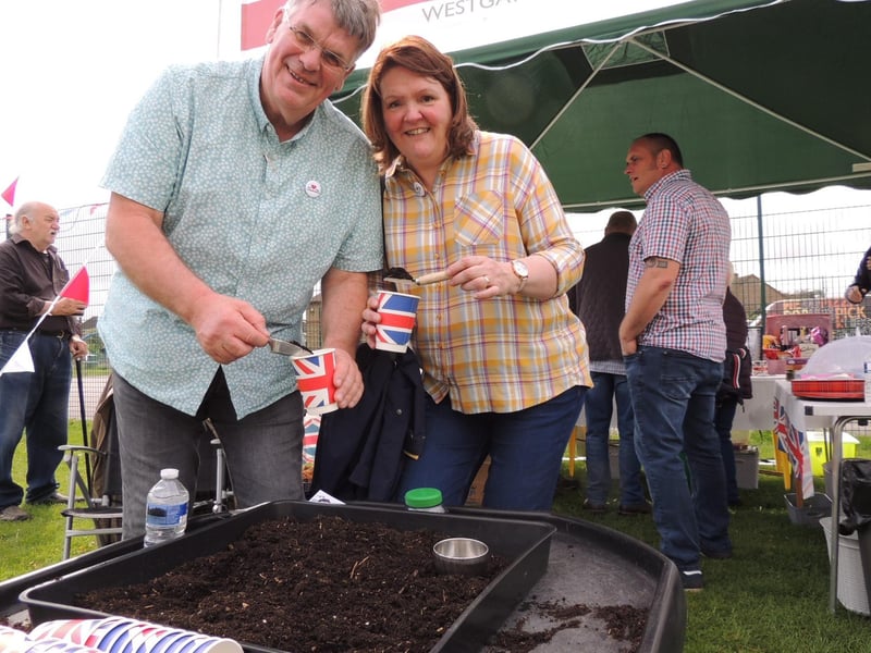 Dave and Deb Rigby of South Lincs Church were inviting people to plant giant sunflower seeds on their stall at Ruskington's coronation fun day.