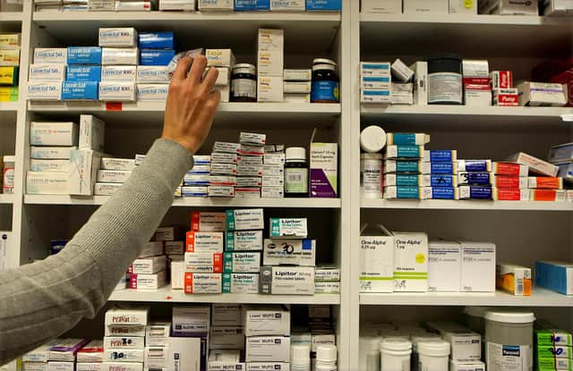 File photo dated 16/11/09 of a pharmacist stocking shelves at a chemist. Pharmacies could ease pressure on the NHS, according to an industry leader. As he prepared to enter into emergency talks with the Prime Minister on Saturday, executive director of Day Lewis pharmacy group Jay Patel said pharmacies could test and treat infections and play a more leading role in prescribing medications. Issue date: Saturday January 7, 2023.