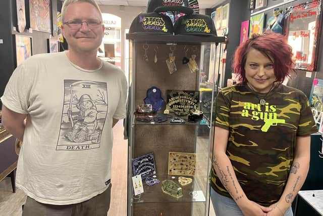 Sam Evardson and Dale Taylor-Lodge with the ouija-themed artwork.