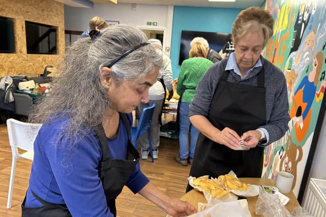 Volunteers Rekha and Meryl hard at work.