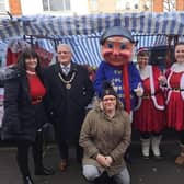 Mayor of Skegness Coun Tony Tye (second right) at the Christmas market in Skegness.