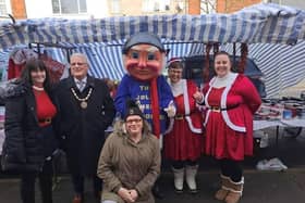 Mayor of Skegness Coun Tony Tye (second right) at the Christmas market in Skegness.